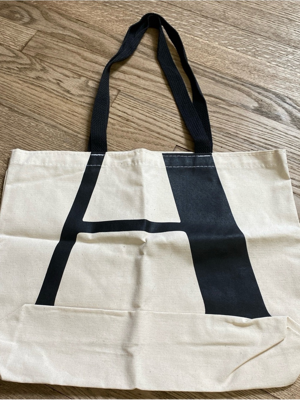 The Atlantic Cream Canvas Tote Bag with Black Letter A and Black Handles